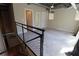 Comfortable loft with neutral walls, carpet, a steel railing, and a view of the downstairs area at 265 18Th Nw St # 2329, Atlanta, GA 30363