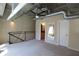 Comfortable loft featuring a ceiling fan, a view of the downstairs area, and access to the bathroom at 265 18Th Nw St # 2329, Atlanta, GA 30363