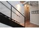 Unique lighting fixture with bicycle decor above a modern wood and metal staircase, adding a stylish touch to the home at 265 18Th Nw St # 2329, Atlanta, GA 30363