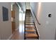 Staircase featuring modern design with open treads and a sleek metal railing leading to the upper floors at 265 18Th Nw St # 2329, Atlanta, GA 30363