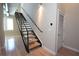 Modern staircase design with wood treads and metal railings leading to upper level with hardwood floors at 265 18Th Nw St # 2329, Atlanta, GA 30363