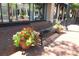 Street view of a bench with planters in front of a storefront on a brick walkway at 265 18Th Nw St # 2329, Atlanta, GA 30363