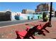 View of a street with Regal Cinemas, planters, new construction, and red chairs at 265 18Th Nw St # 2329, Atlanta, GA 30363