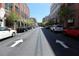 Street view of a street with stores, parked cars, trees, and brick buildings at 265 18Th Nw St # 2329, Atlanta, GA 30363