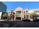 Street view of commercial buildings with restaurants, storefronts, sidewalks, and green space with a blue sky overhead at 265 18Th Nw St # 2329, Atlanta, GA 30363