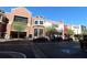 Street view of commercial buildings, sidewalks, parking spots, and storefronts surrounded by sidewalks and green space at 265 18Th Nw St # 2329, Atlanta, GA 30363