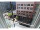 View from window of a street with a LOFT store, people, and trees at 265 18Th Nw St # 2329, Atlanta, GA 30363