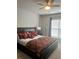 Cozy bedroom with ceiling fan, carpeted floors, and a window providing natural light at 2660 Bateman Sw St, Powder Springs, GA 30127