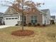 Charming single-Gathering home with a well-manicured front yard and attached two-car garage at 2660 Bateman Sw St, Powder Springs, GA 30127