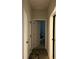 Bright hallway with white doors and trim, wood-look flooring, and access to multiple rooms at 2660 Bateman Sw St, Powder Springs, GA 30127