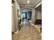 Elegant hallway with wood floors, neutral walls, and decorative accents leading to other rooms at 2660 Bateman Sw St, Powder Springs, GA 30127