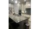 A kitchen featuring granite countertops, stainless steel appliances, and an island with barstool seating at 2660 Bateman Sw St, Powder Springs, GA 30127