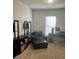Cozy home office with a comfortable black chair, desk, and shelving for organized workspace at 2660 Bateman Sw St, Powder Springs, GA 30127