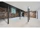 Large basement space with wood accent walls and metal support beams at 2875 Oldknow Nw Dr, Atlanta, GA 30318
