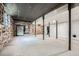 Spacious basement featuring concrete floor and wood accent walls at 2875 Oldknow Nw Dr, Atlanta, GA 30318