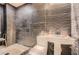 Unique bathroom with textured walls, a pedestal sink, and modern toilet at 2875 Oldknow Nw Dr, Atlanta, GA 30318