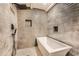 Contemporary bathroom featuring a luxurious soaking tub and stylish fixtures at 2875 Oldknow Nw Dr, Atlanta, GA 30318