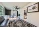 Bright bedroom featuring a ceiling fan and a glimpse into the bathroom at 2875 Oldknow Nw Dr, Atlanta, GA 30318
