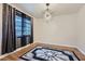 Cozy dining room features hardwood floors, a geometric light fixture, and a window offering ample natural light at 2875 Oldknow Nw Dr, Atlanta, GA 30318