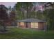 Charming brick home featuring a well-manicured lawn and mature trees, creating a peaceful and inviting curb appeal at 2875 Oldknow Nw Dr, Atlanta, GA 30318