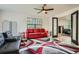 Bright living room with modern decor, a ceiling fan, and large windows at 2875 Oldknow Nw Dr, Atlanta, GA 30318