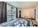 Spacious living room featuring hardwood floors, large windows with curtains, and a view of the neighborhood at 2875 Oldknow Nw Dr, Atlanta, GA 30318