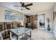 Cozy living room with plush seating, fireplace, and ceiling fan at 2875 Oldknow Nw Dr, Atlanta, GA 30318