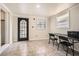 Office area with a large window and glass door provides ample natural light in the cozy workspace at 2875 Oldknow Nw Dr, Atlanta, GA 30318