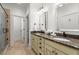 Bright bathroom featuring double vanity with granite countertop and decorative lighting at 3180 Ashton Old Rd, Douglasville, GA 30135