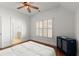 Comfortable bedroom with hardwood floors, cabinet and view into ensuite bath at 3180 Ashton Old Rd, Douglasville, GA 30135