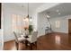 Cozy dining room with a glass-top table, modern chairs, and natural light streaming through the windows at 3180 Ashton Old Rd, Douglasville, GA 30135