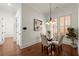 Elegant dining area with a glass table, stylish chairs, and plenty of natural light at 3180 Ashton Old Rd, Douglasville, GA 30135