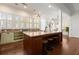 Bright kitchen with large island, granite countertops, stainless steel appliances, and abundant natural light from large windows at 3180 Ashton Old Rd, Douglasville, GA 30135