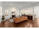 Bright living room featuring a fireplace, large windows, and hardwood floors at 3180 Ashton Old Rd, Douglasville, GA 30135
