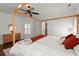 Well-lit bedroom with a four-poster bed, natural light and access to an ensuite bathroom at 3180 Ashton Old Rd, Douglasville, GA 30135