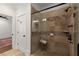 Walk-in shower with dual shower heads featuring tiled walls and a glass door at 3180 Ashton Old Rd, Douglasville, GA 30135