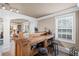 Basement wet bar area with ample shelving for storage and prep space for entertaining at 6597 River Island Dr, Buford, GA 30518