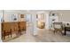 The basement is set up for entertaining guests with a custom bar, neutral walls, and several seating areas at 6597 River Island Dr, Buford, GA 30518