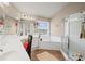 Bathroom with a soaking tub, glass shower, and double sink vanity at 6597 River Island Dr, Buford, GA 30518