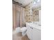 Bathroom with floral wallpaper, and a shower over the bath at 6597 River Island Dr, Buford, GA 30518