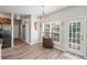 Bright dining area features a window with natural light and access to an outdoor space at 6597 River Island Dr, Buford, GA 30518