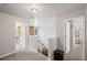 Upstairs hallway with a view down to the Gathering room at 6597 River Island Dr, Buford, GA 30518