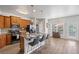 Modern kitchen with stainless steel appliances, a center island with seating, and ample cabinet space at 6597 River Island Dr, Buford, GA 30518