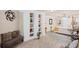 Relaxing living area with a decorative bookshelf, neutral color palette, and stylish accents at 6597 River Island Dr, Buford, GA 30518