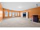 Spacious bonus room with lots of windows, carpeted floors, and a built-in bar area for entertaining guests at 3750 Lake Haven Way, Atlanta, GA 30349