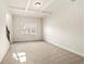 Cozy bonus room with coffered ceiling, large window, and neutral carpet at 3750 Lake Haven Way, Atlanta, GA 30349