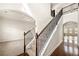 Grand foyer with staircase and coffered ceilings at 3750 Lake Haven Way, Atlanta, GA 30349