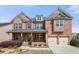 Beautiful two-story brick home featuring a welcoming front porch and a two-car garage at 3750 Lake Haven Way, Atlanta, GA 30349