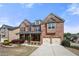 Lovely brick home with a charming front porch, landscaped yard, and a convenient two-car garage at 3750 Lake Haven Way, Atlanta, GA 30349