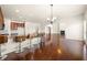 Open concept kitchen featuring bar seating, stainless appliances, and hardwood floors at 3750 Lake Haven Way, Atlanta, GA 30349